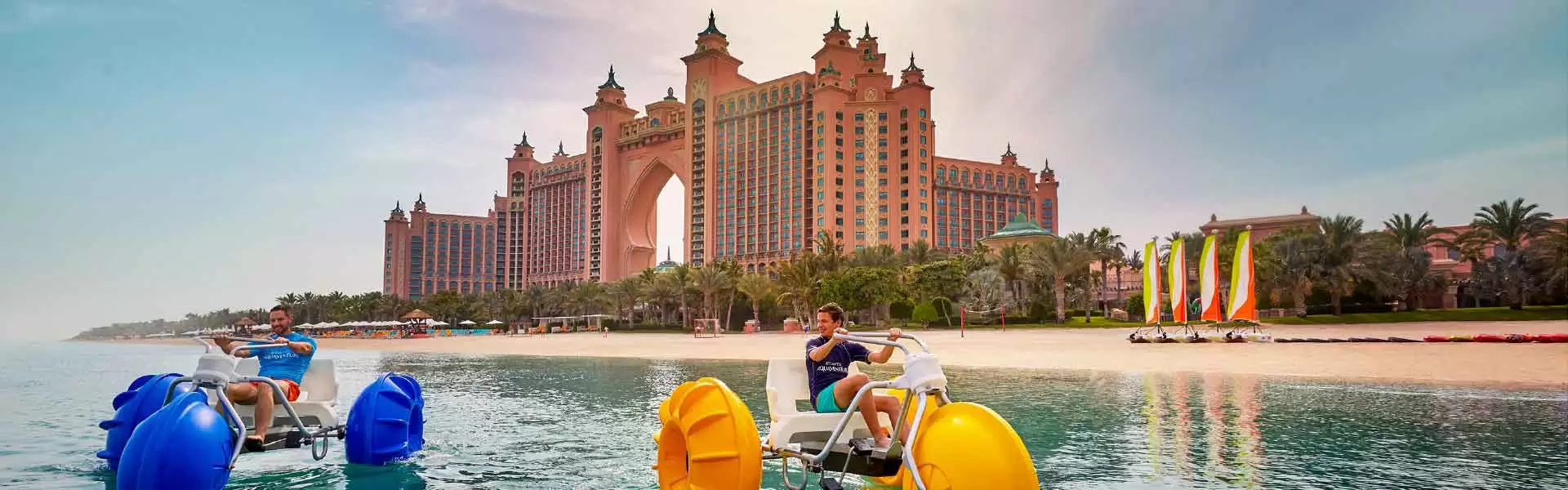 Banner image of Hotel Atlantis and tourist enjoying in the beach