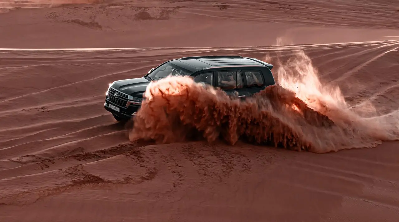 Dubai desert safari with dune bashing and camel rides in Arabian desert