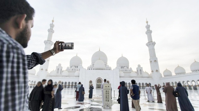 Image of man clicking a picture in UAE