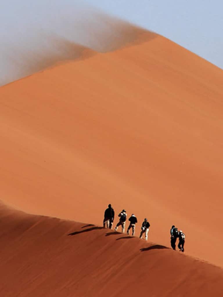Tourist enjoying desert safari in Dubai and beautiful view of the desert