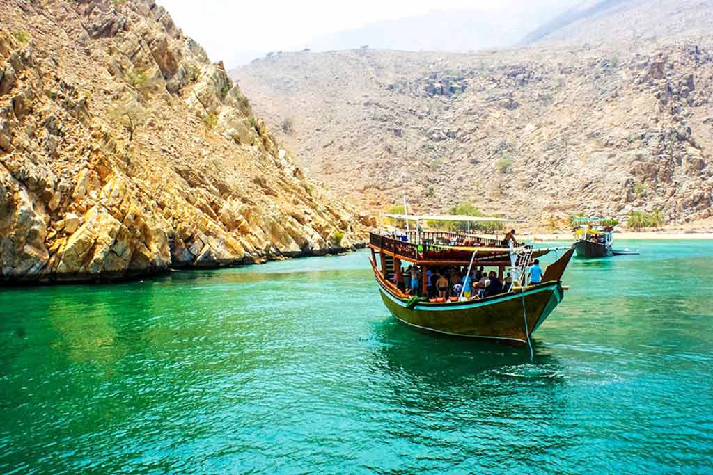 Image of Musandam Dibba with traditional wooden Dhow cruise in Arabian Gulf