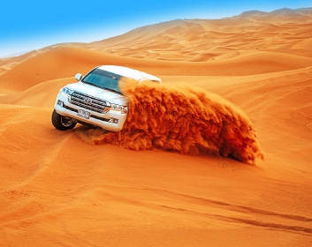 Desert safari image on the Arabian desert with tourists inside